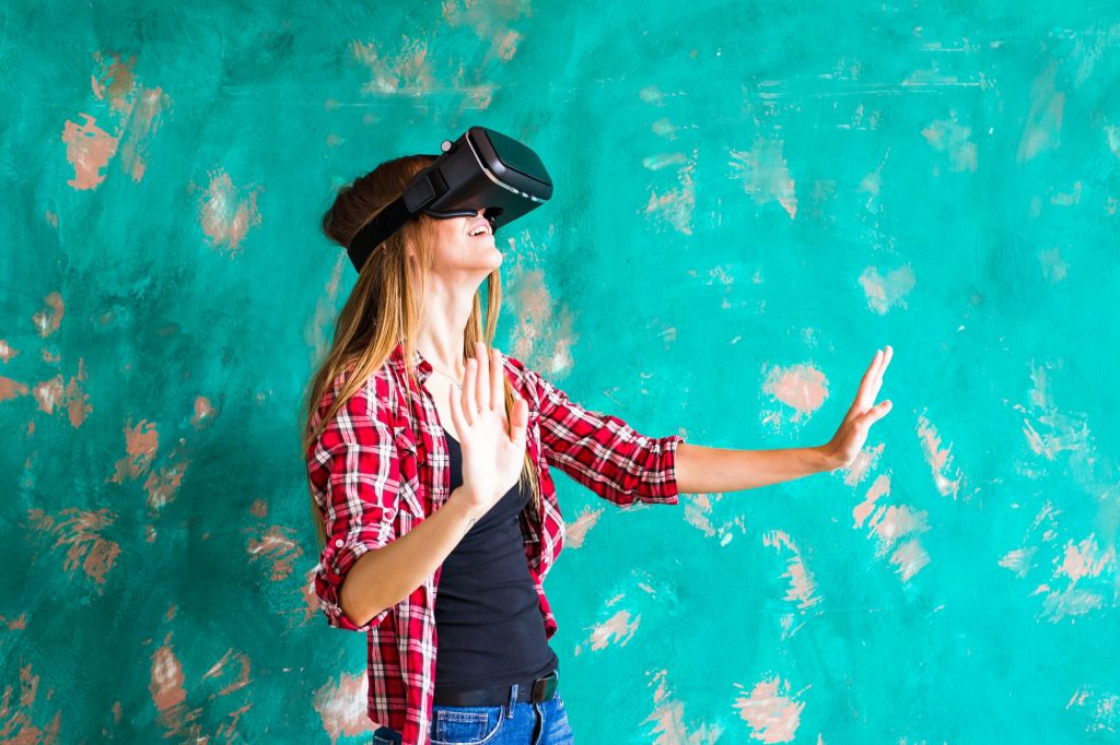 woman getting experience using VR-headset glasses of virtual reality